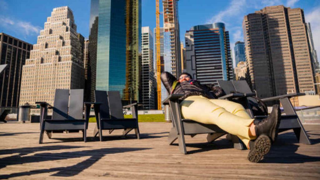 the mature woman resting on the pier 15 east river esplanades in manhattan downtown